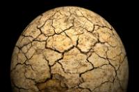 Seen from space a planet suffering from drought, dry and cracking, with no life